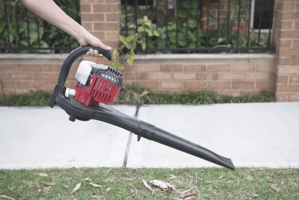 a man is using best commercial leaf vacuum